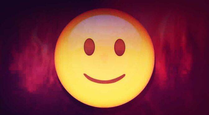 A smiley face on a dark background, alleviating stress.